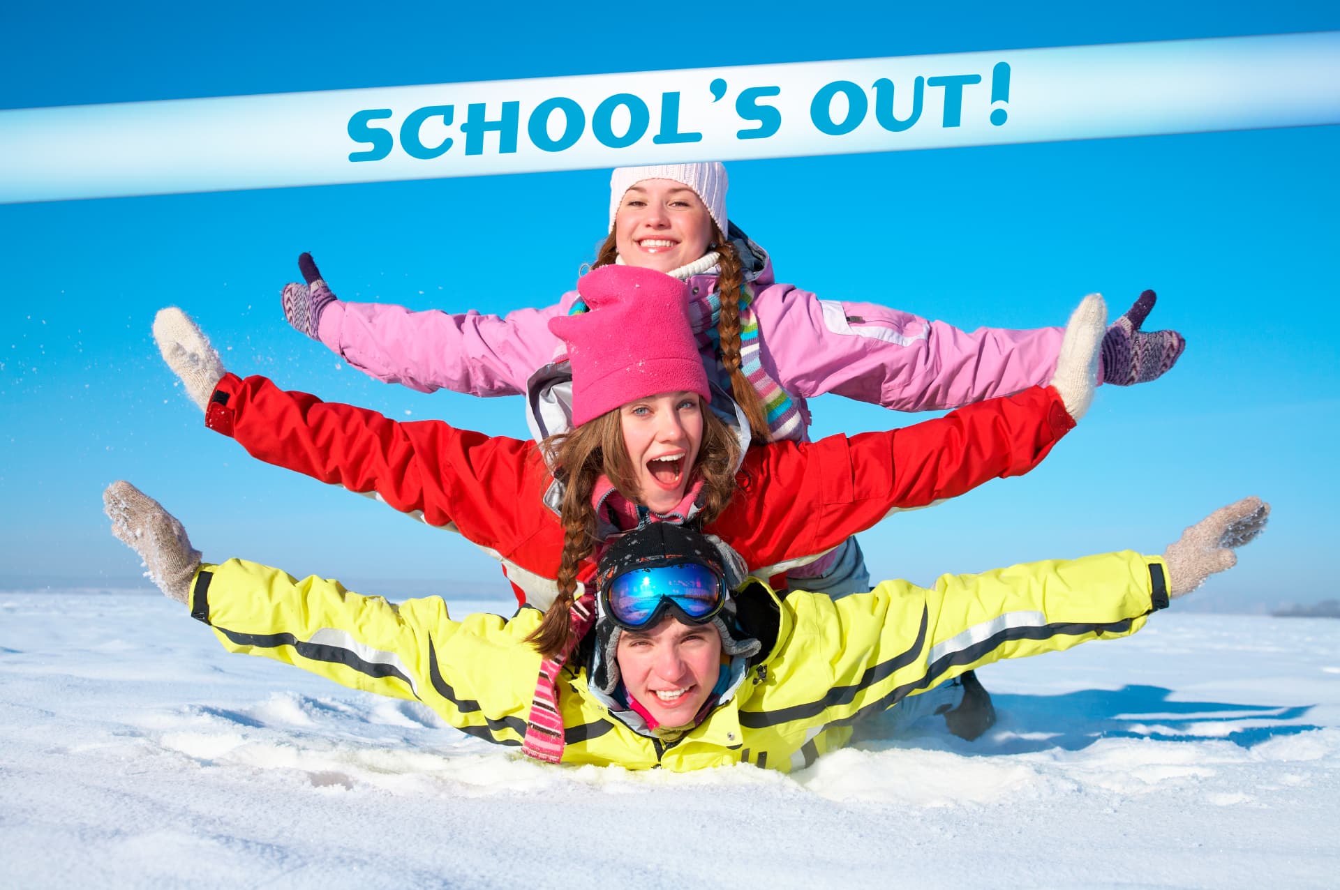 Three skiers have fun in the snow, captioned "School's Out"