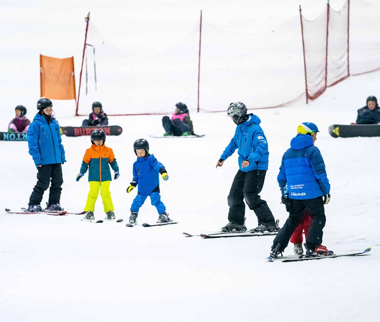 Kids having fun learning to ski at Snowplanet