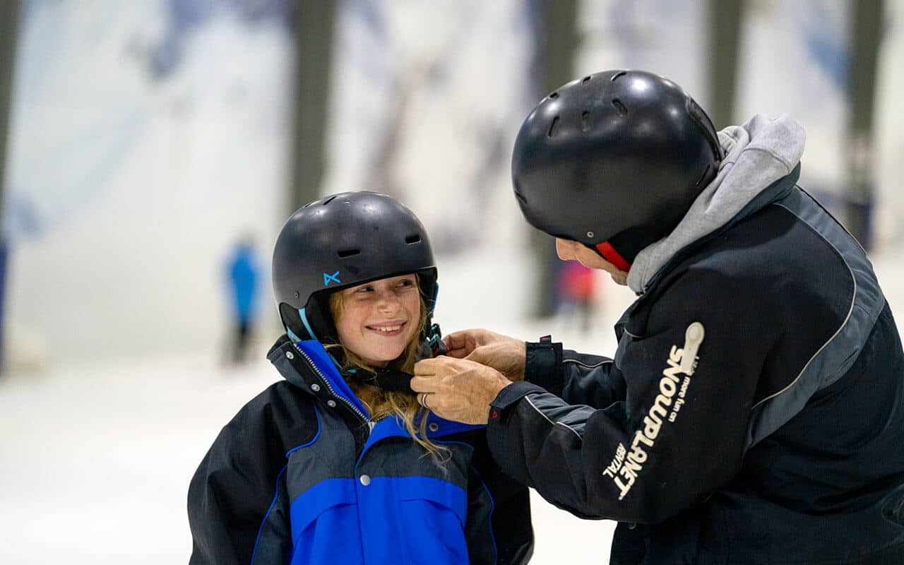 School kids wear helmets at Snowplanet