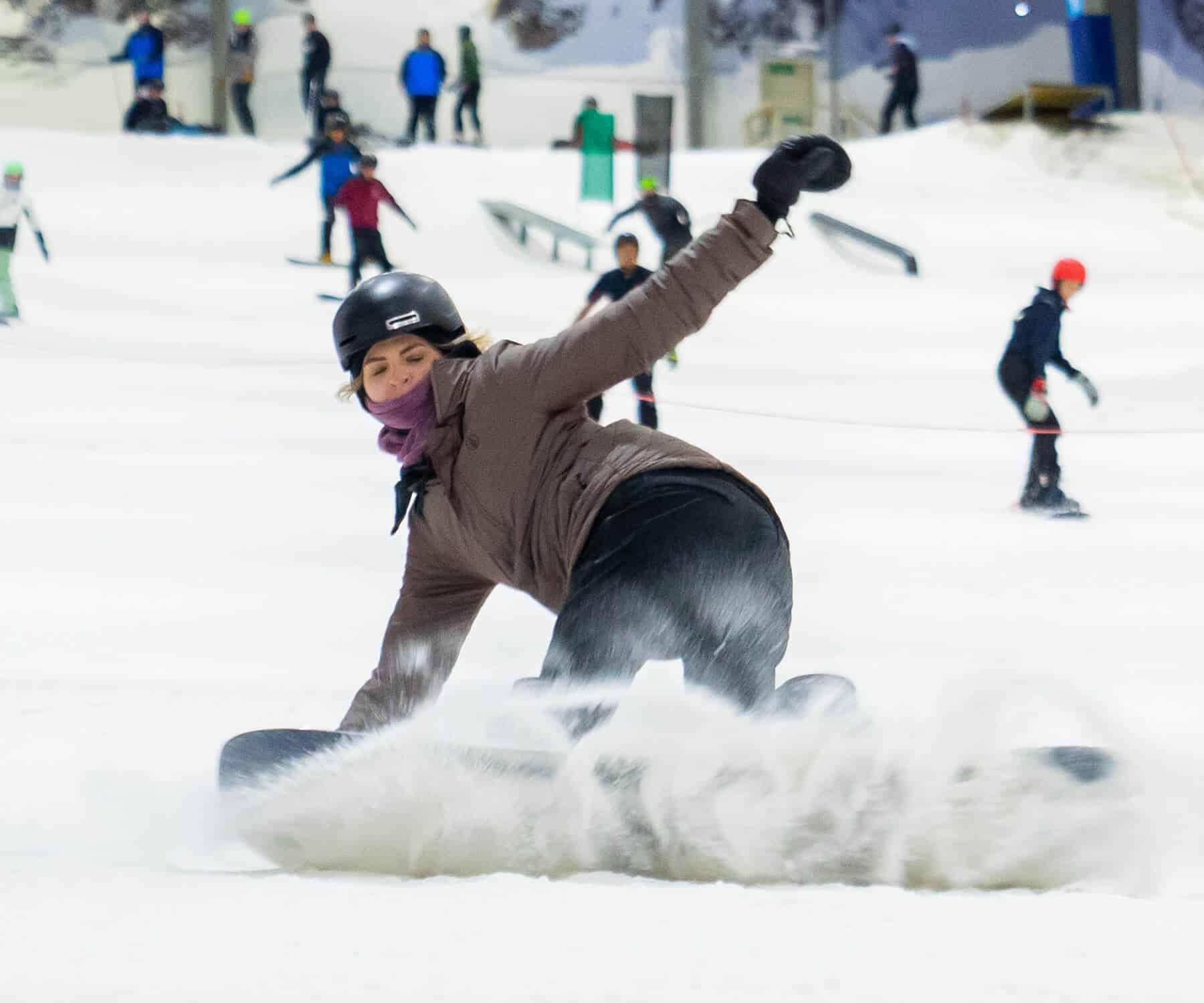 Advanced female snowboarder shreds Snowplanet
