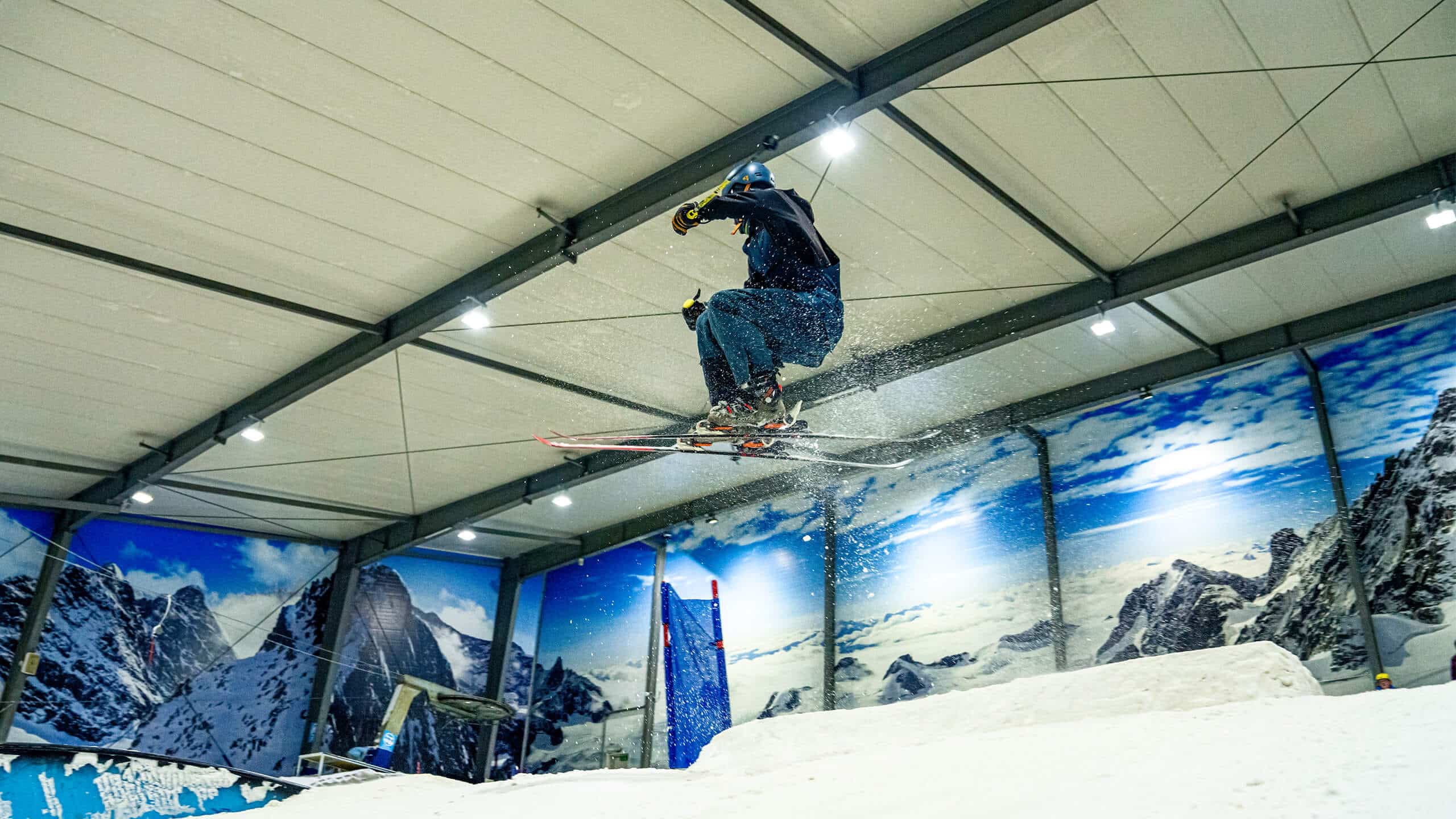 Freestyle Skier does a jump in Snowplanet Terrain Park