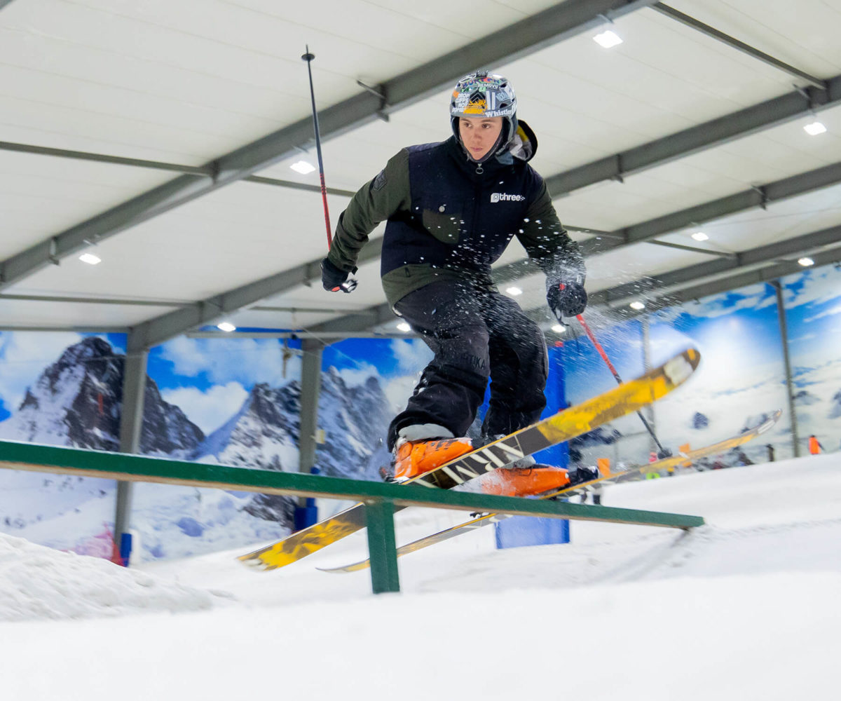 Skier rail grinding on Snowplanet's Terrain Park