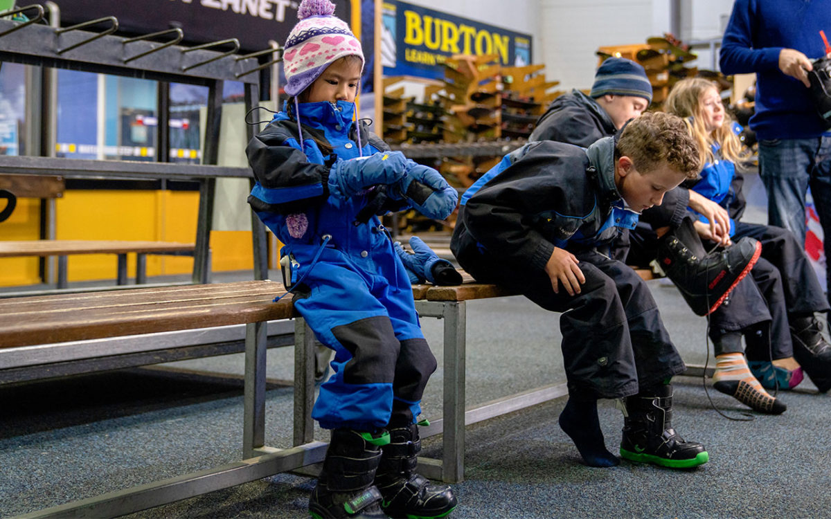 Kids putting on snow gear